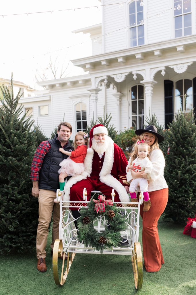 Nicki Odom and family with Santa at Holiday Magic at Merrimon-Wynne