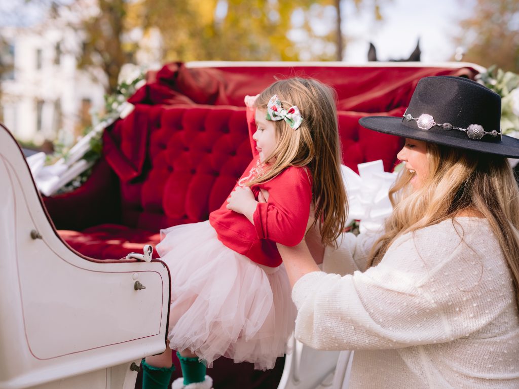 Nicki Odom with Daughter on horse and carriage in Raleigh NC