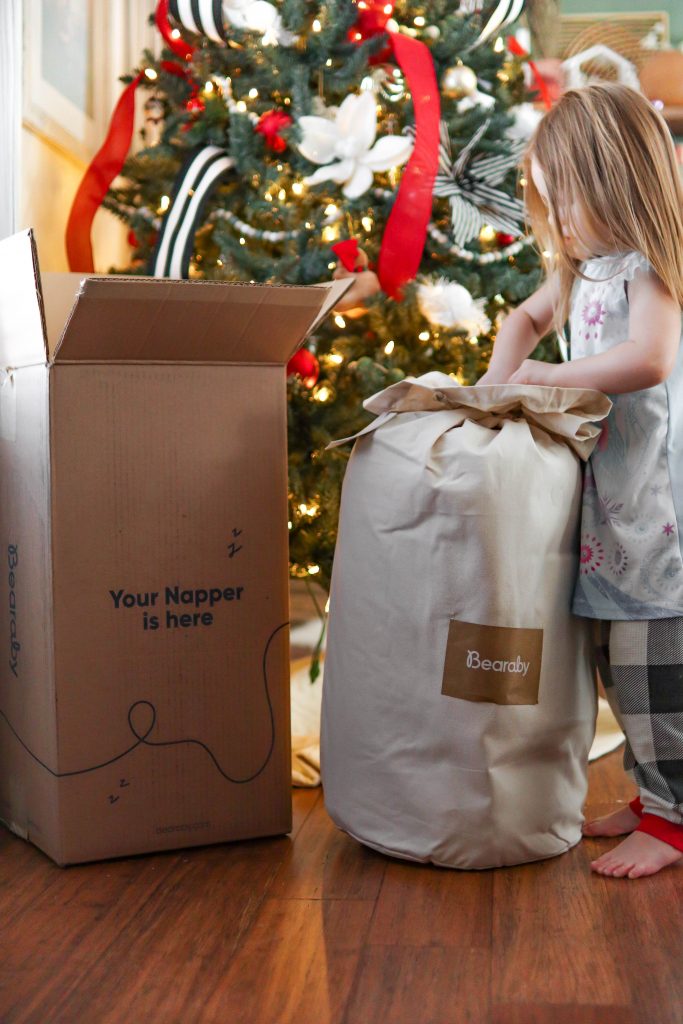 Bearaby Tree Napper Cooling Weighted Blanket laying across Nicki Odom's bed