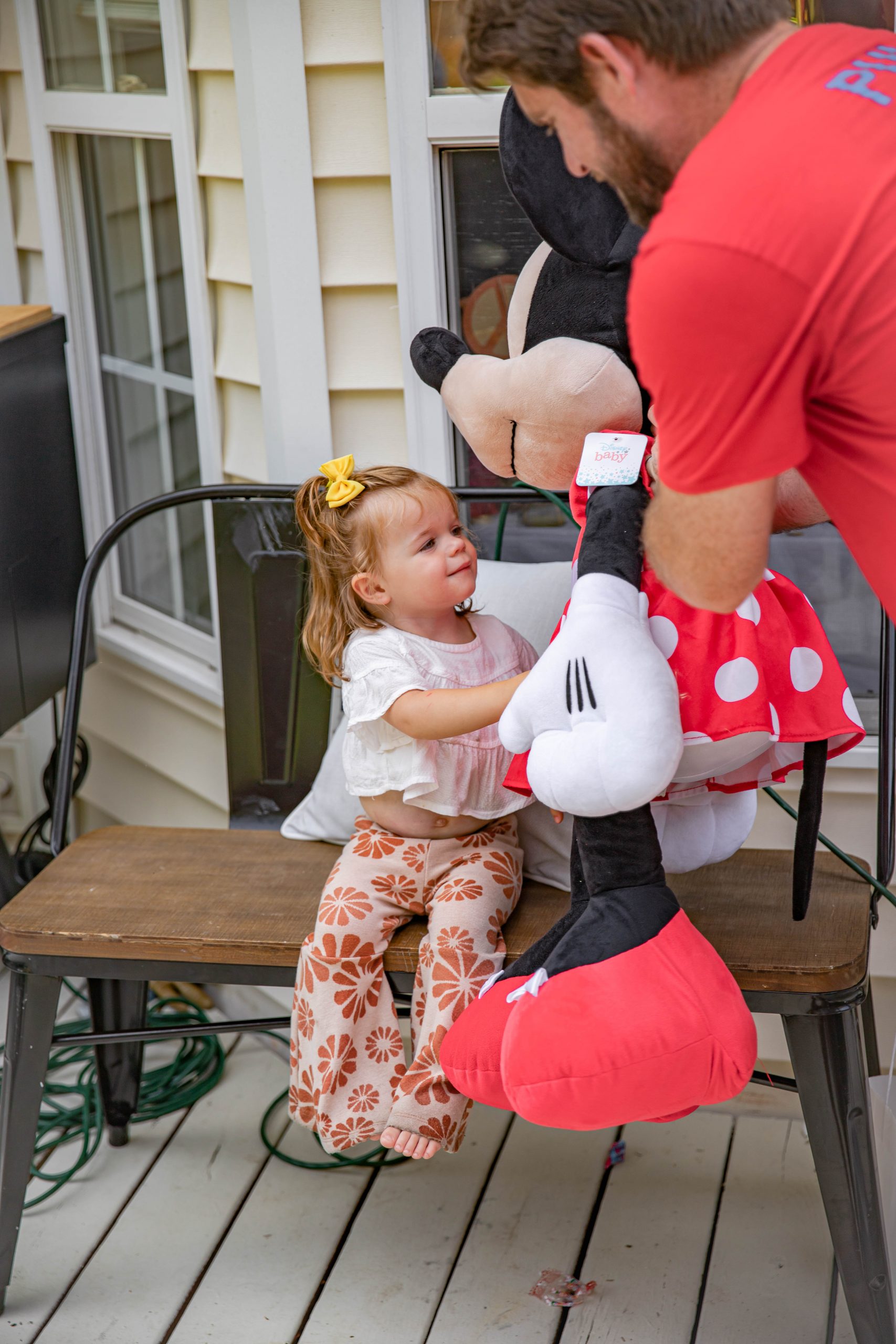 Nicki Odom daughter with new birthday present at Second birthday