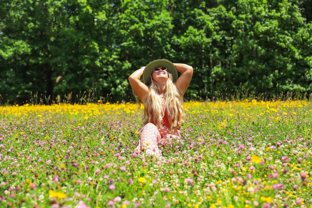 Nicki Odom at Wanderlust Family Retreats in wild flower field