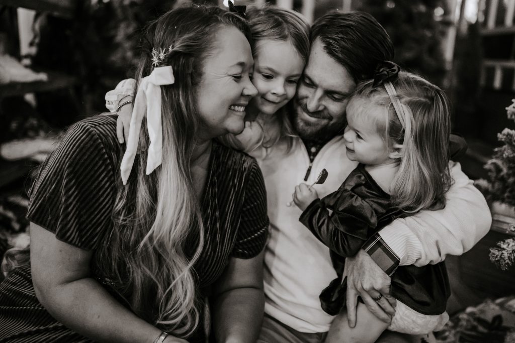 Nicki Odom and family in Family Christmas photoshoot by Kristin Guynn in Black and White