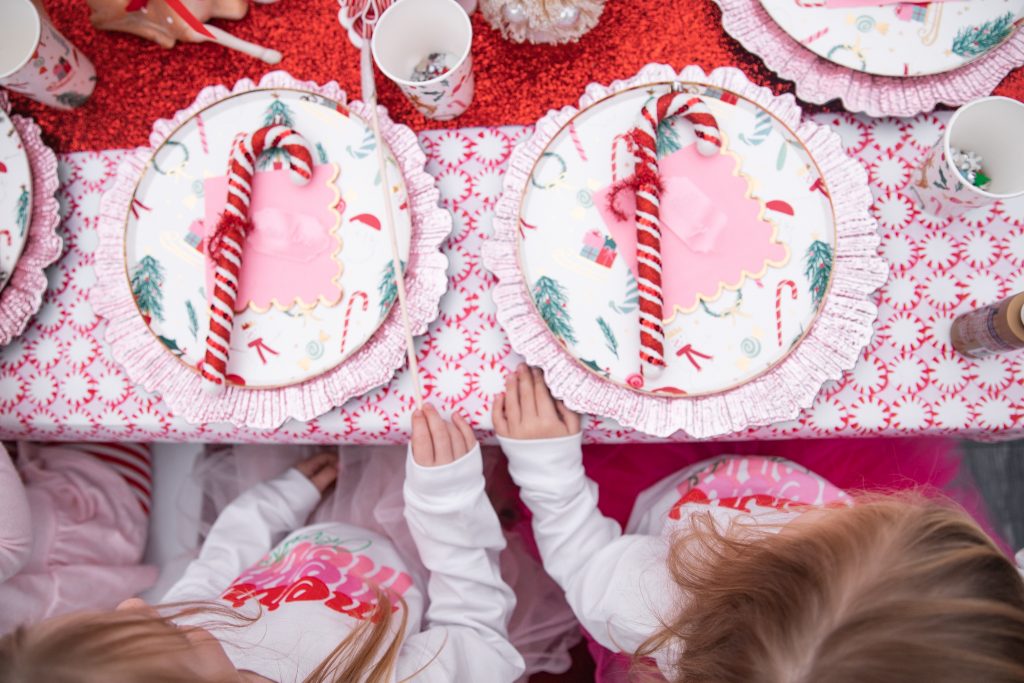 Nicki Odom with daughters in Christmas outfits at Candy cane tea party