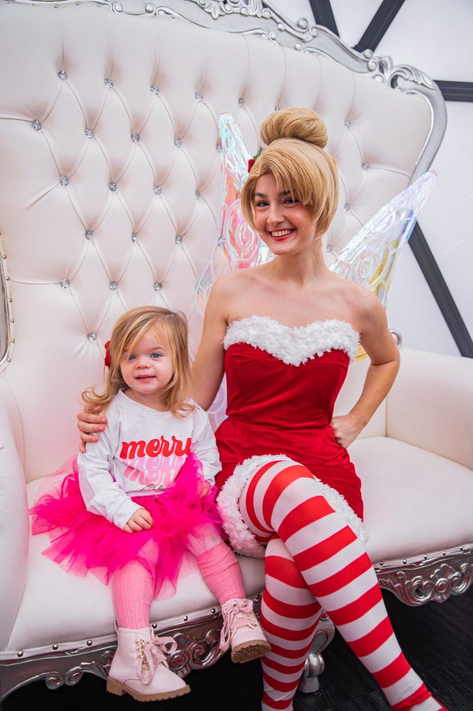 Nicki Odom with daughters make magic wands at Candy Cane Christmas tea party with Tinkerbell