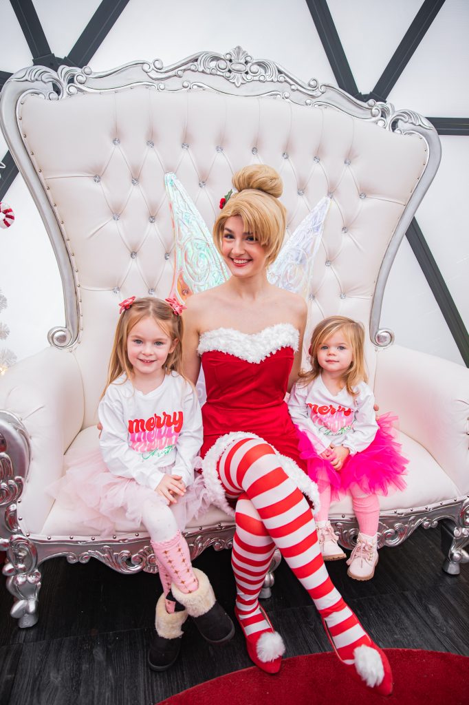 Nicki Odom with daughters make magic wands at Candy Cane Christmas tea party with Tinkerbell