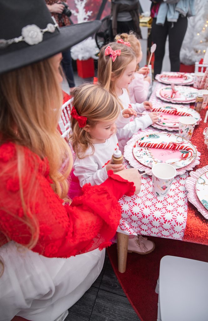 Nicki Odom with daughters make magic wands at Candy Cane Christmas tea party