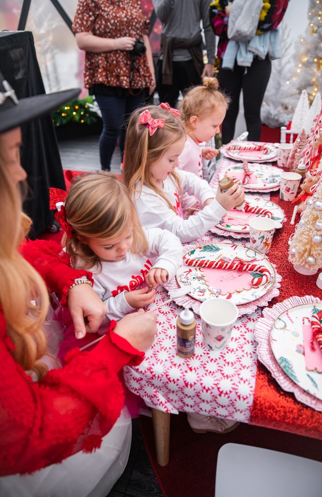 Nicki Odom with daughters make magic wands at Candy Cane Christmas tea party