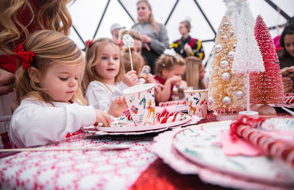 Nicki Odom with daughters make magic wands at Candy Cane Christmas tea party