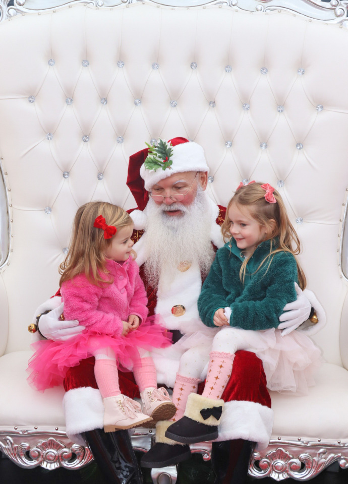 Nicki Odom and daughters visit with Santa in his igloo at Fenton, Cary NC