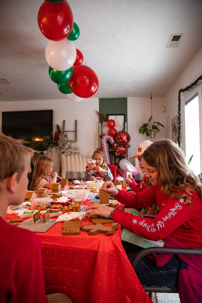 kids at Christmas Gingerbread House making party