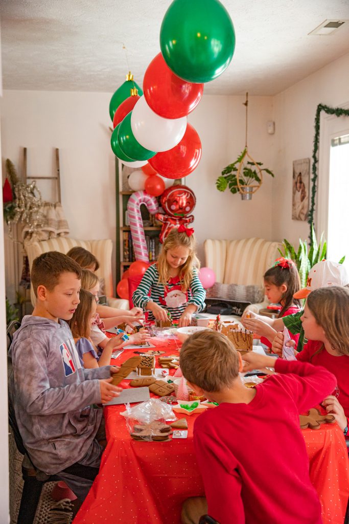 kids at Christmas Gingerbread House making party