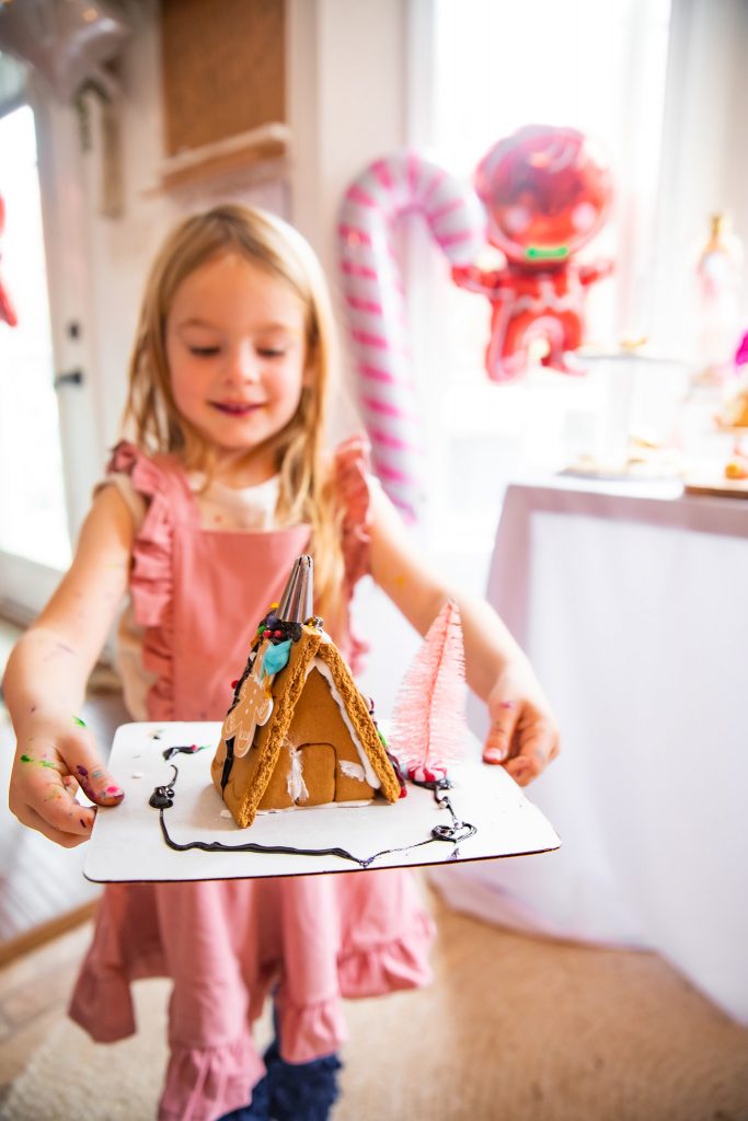Nicki Odom's daughter at Christmas Gingerbread House making party