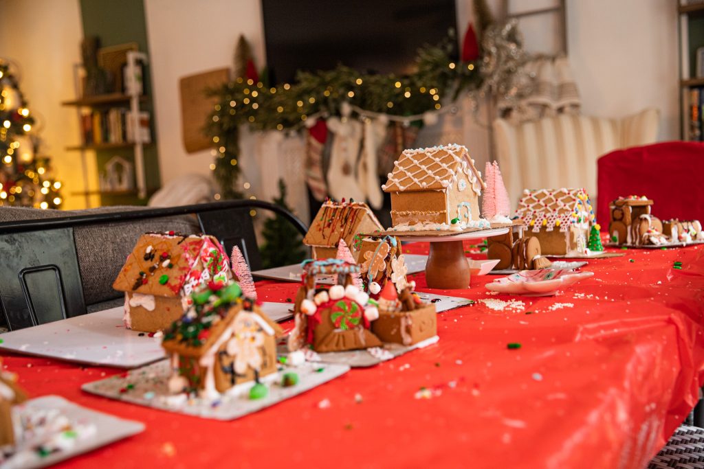 Christmas Gingerbread House Party with gingerbread houses displayed on the table