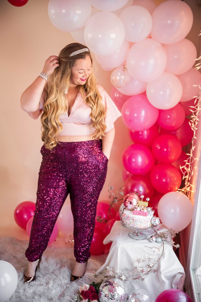 Birthday photoshoot with disco balls for Nicki Odom's 35th Birthday wearing plum sequin joggers How To Face Your Fears in 2023
