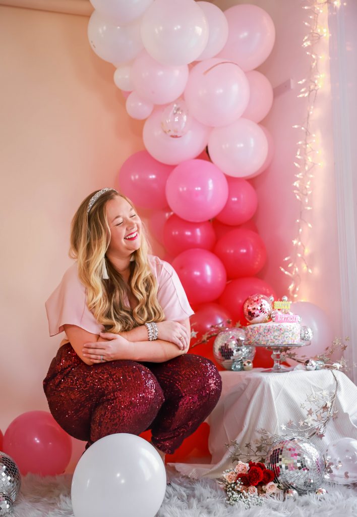 Birthday photoshoot with disco balls for Nicki Odom's 35th Birthday wearing plum sequin joggers How To Face Your Fears in 2023