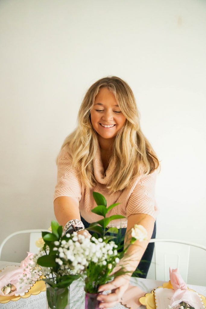 Nicki Odom setting the table with tips for being a good host