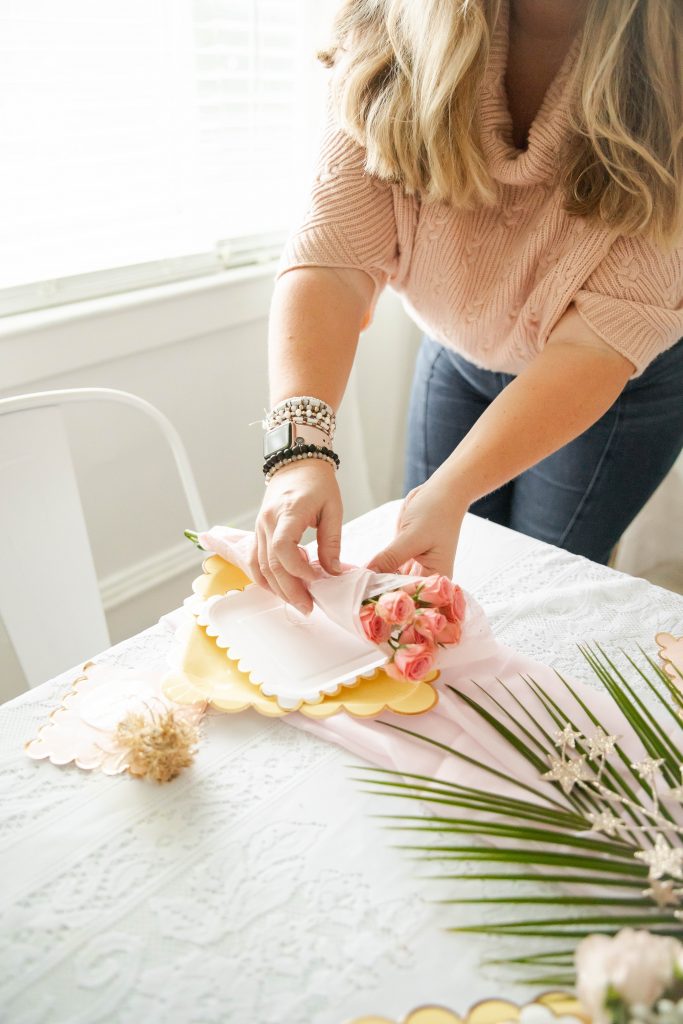 Nicki Odom hosting a party and setting the table