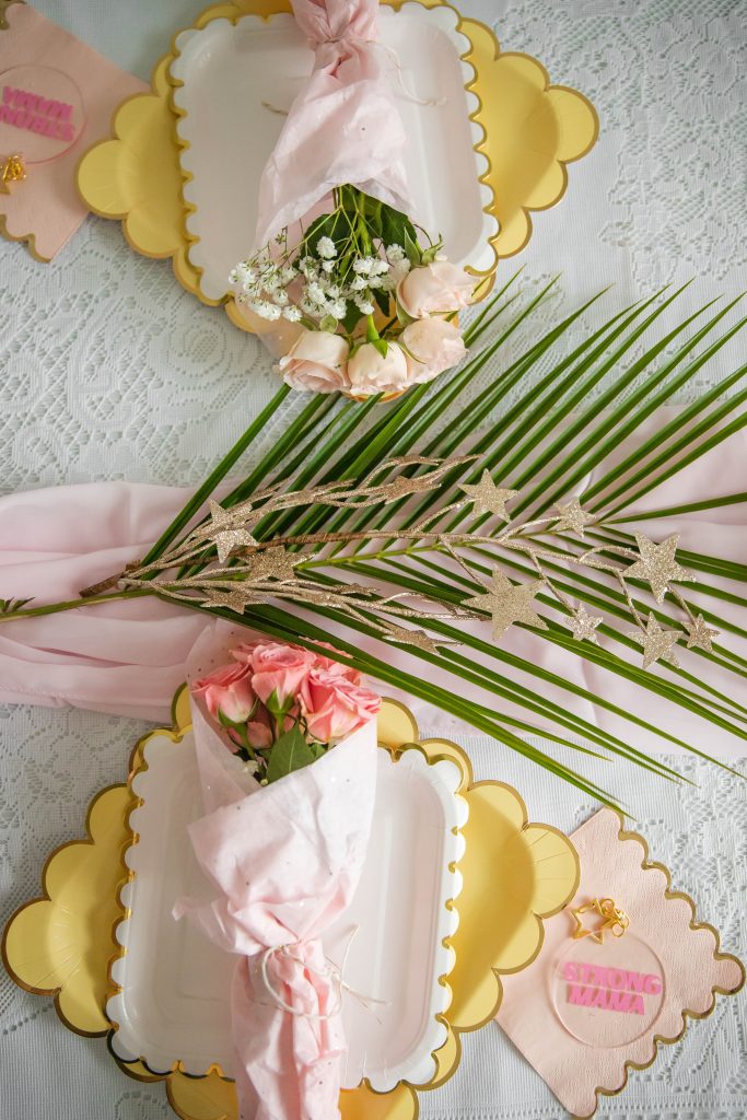 Palm fronds dinner table set up for a party by Nicki Odom from The Boho Diaries 