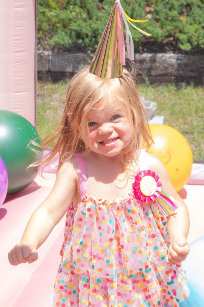 Nicki Odom's daughter on bouncy castle at Peppa Pig 3rd Birthday Party