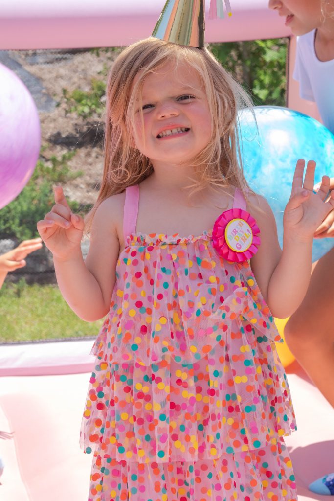 Nicki Odom's daughter on bouncy castle at Peppa Pig 3rd Birthday Party