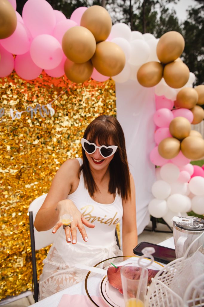 Bride To Be sitting at Party Table for Bachelorette Pool Party