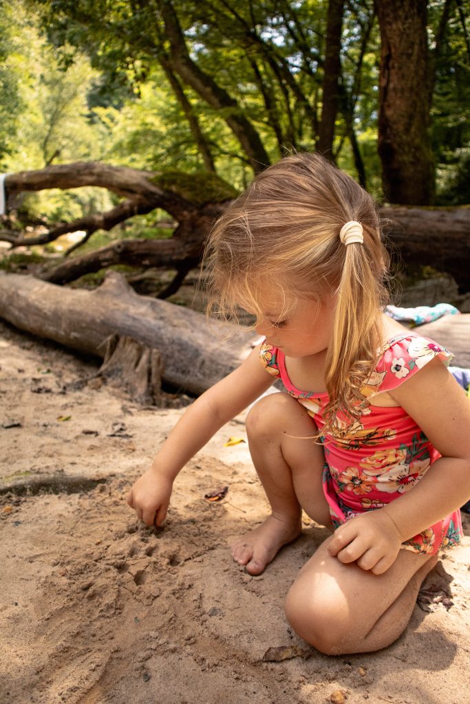 Nicki Odom's daughter at Carter Falls plying on the beach Elkin NC