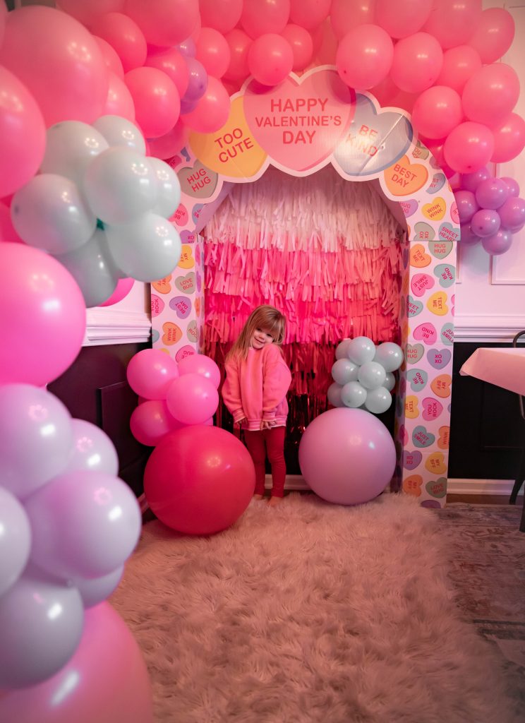 Galentines Day Make and Take DIY Craft Party with balloon arches and conversation hearts