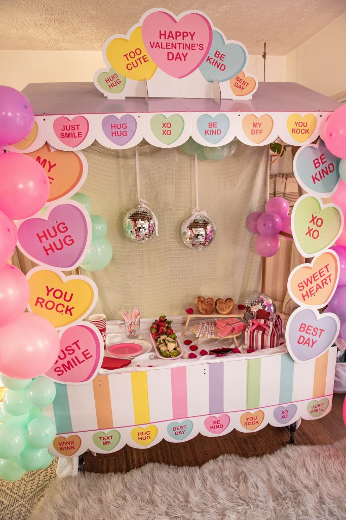 Galentines Day Make and Take DIY Craft Party with balloon arches and conversation hearts