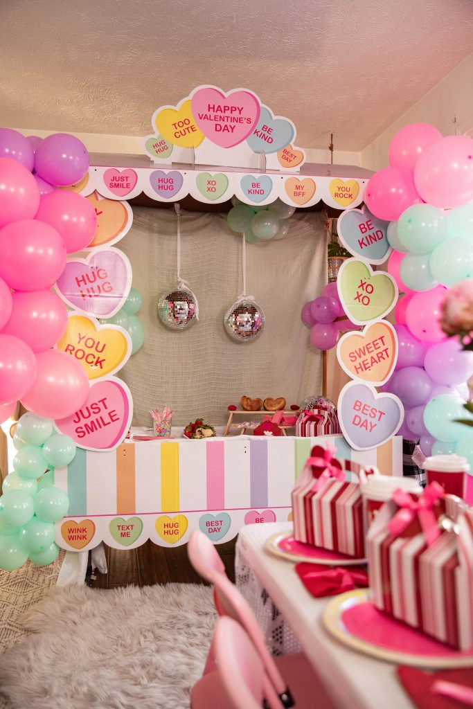 Galentines Day Make and Take DIY Craft Party with balloon arches and conversation hearts