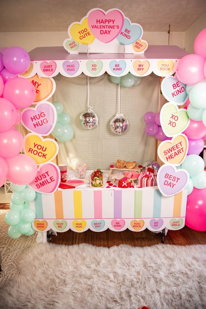 Galentines Day Make and Take DIY Craft Party with balloon arches and conversation hearts