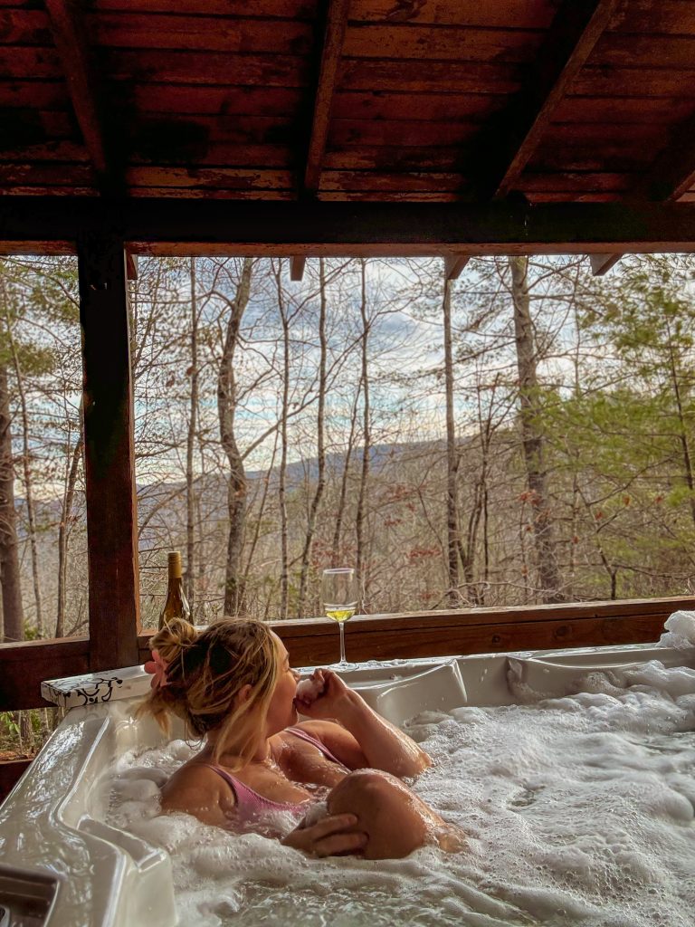 Nicki Odom in hot tub at Mountain Getaway at 36 North Cabins in Purlear NC