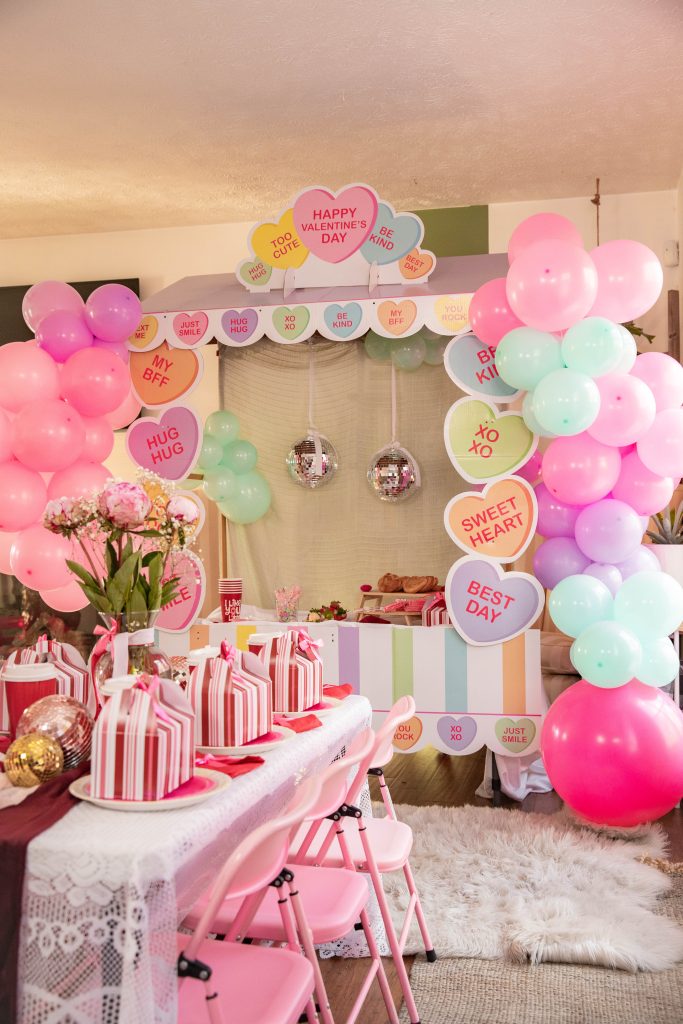 Galentines Day Make and Take DIY Craft Party with balloon arches and conversation hearts