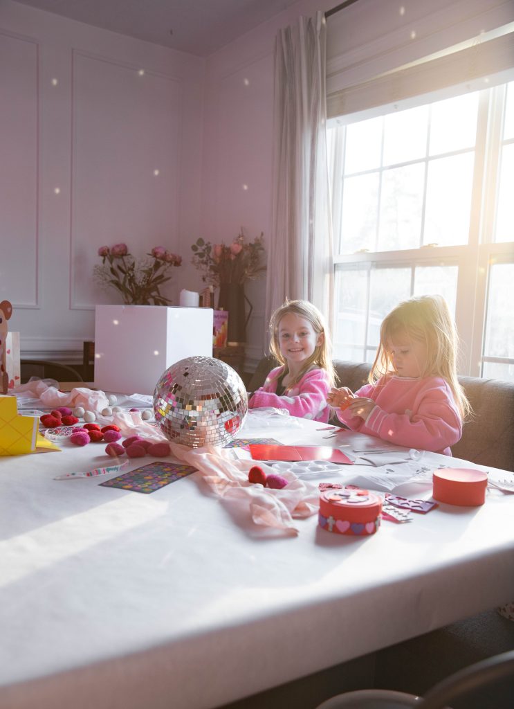 Galentines Day Make and Take DIY Craft Party with balloon arches and conversation hearts