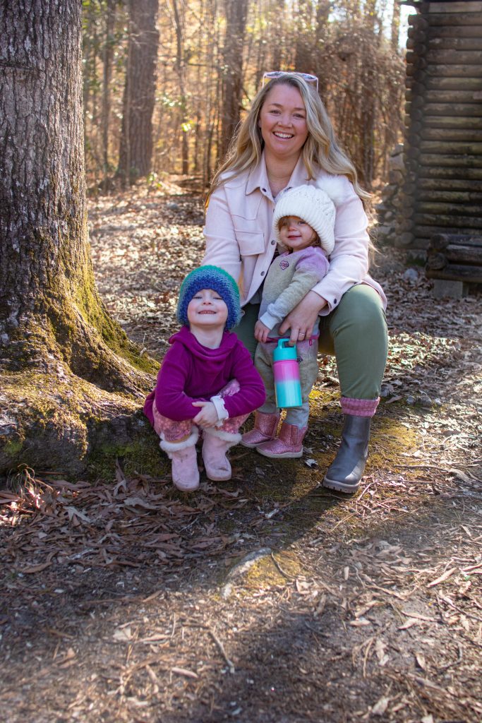Nicki Odom with daughters in the forest