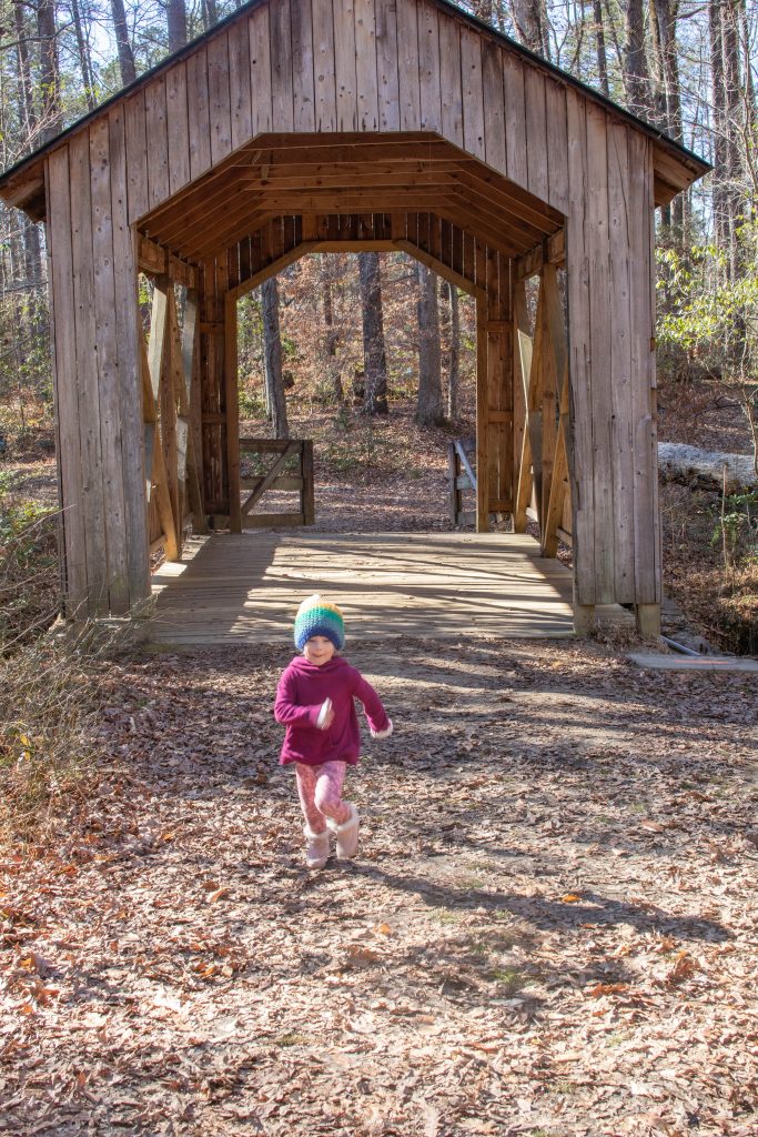 Nicki Odom daughter running across bridge