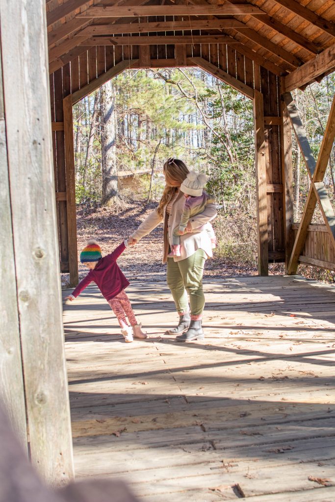 Nicki Odom with toddler daughters at the park