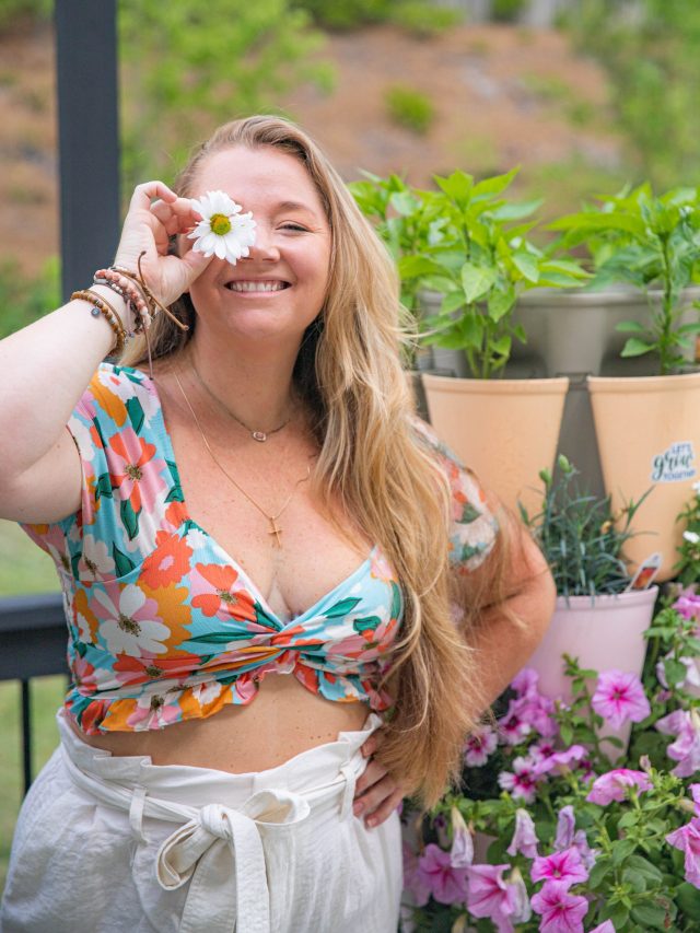 Nicki Odom with flower over one eye and body positivity