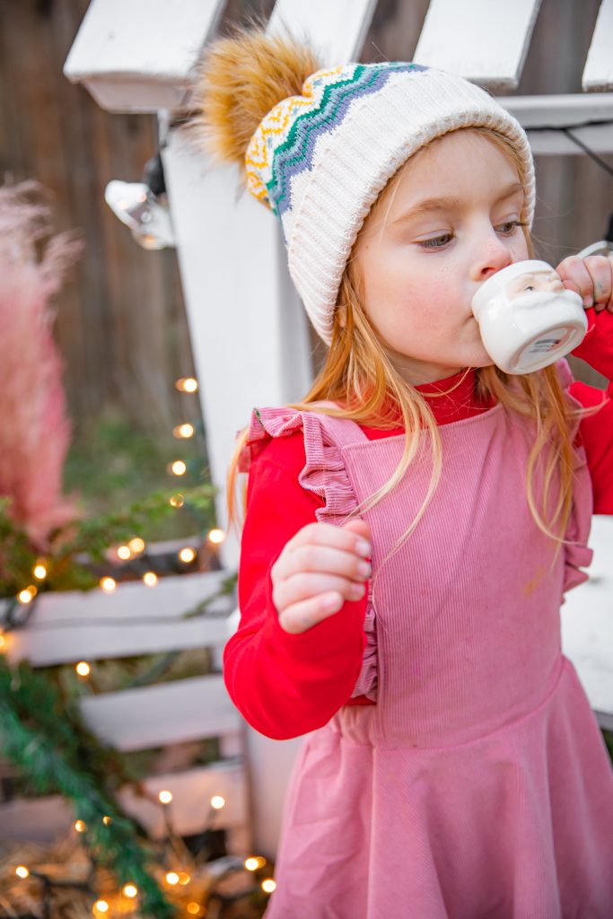 Kids Christmas Tree Farm Photoshoot - Nicki Odom's daughter drinking hot chocolate