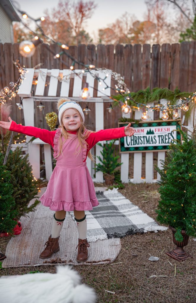 Kids Christmas Tree Farm Photoshoot - Nicki Odom's daughter drinking hot chocolate