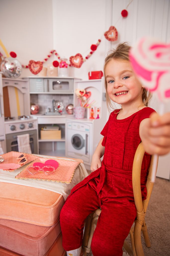 Valentines treat ideas with daughter holding a lollipop