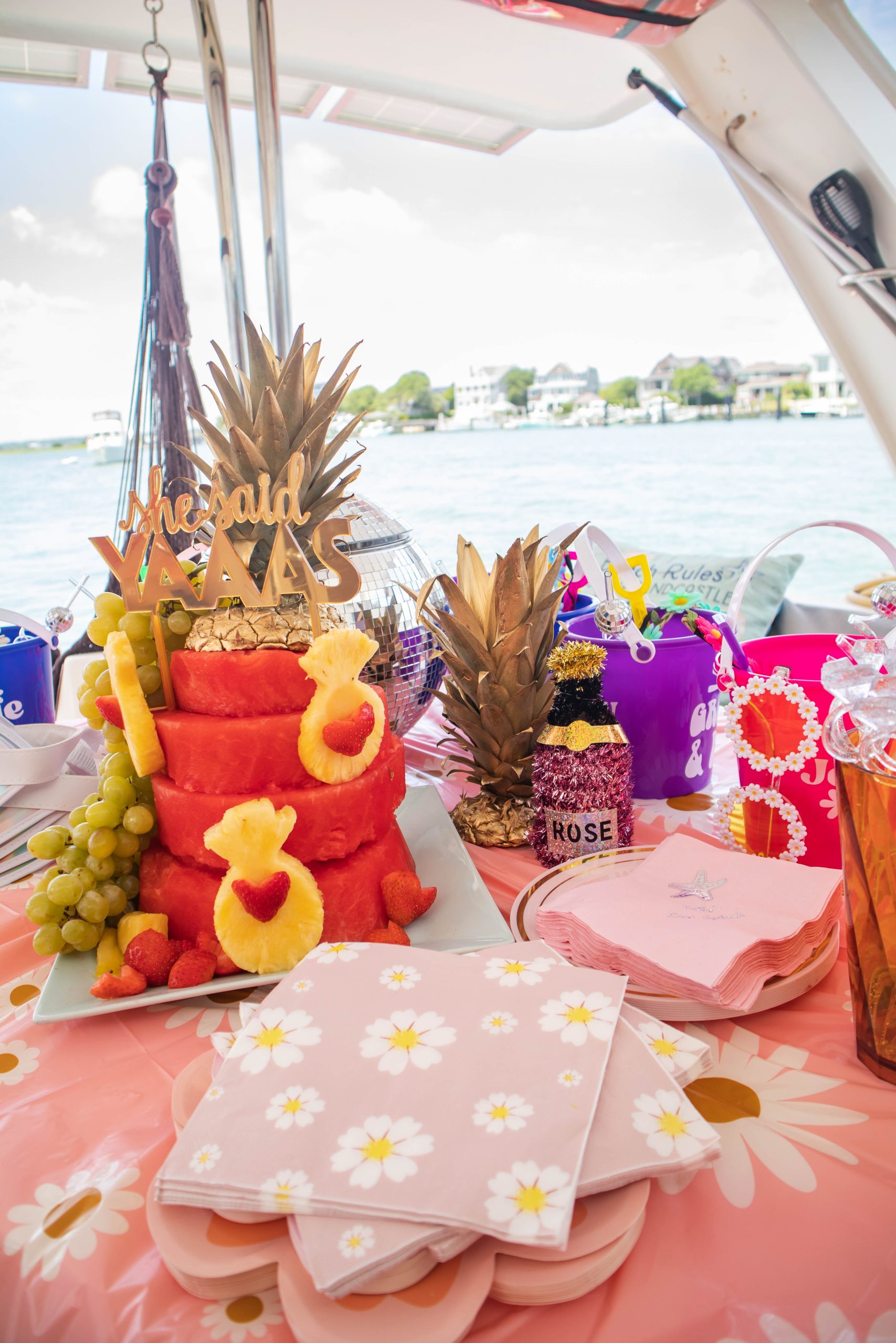 Bachelorette Party on a boat with watermelon cake and party favors