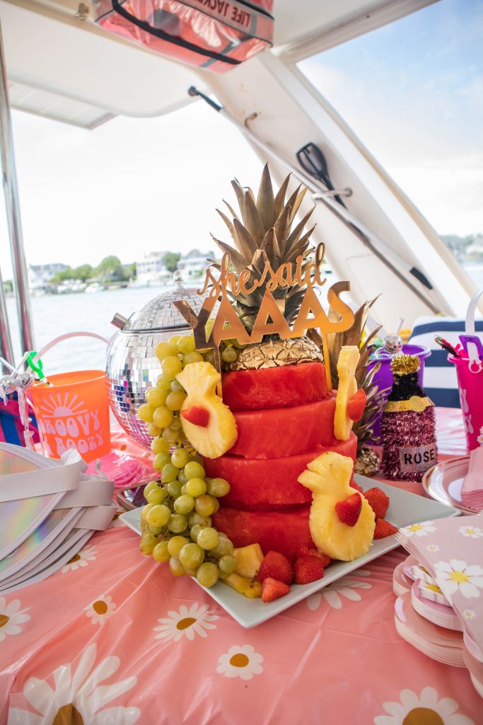 Bachelorette Party on a boat with watermelon cake and party favors
