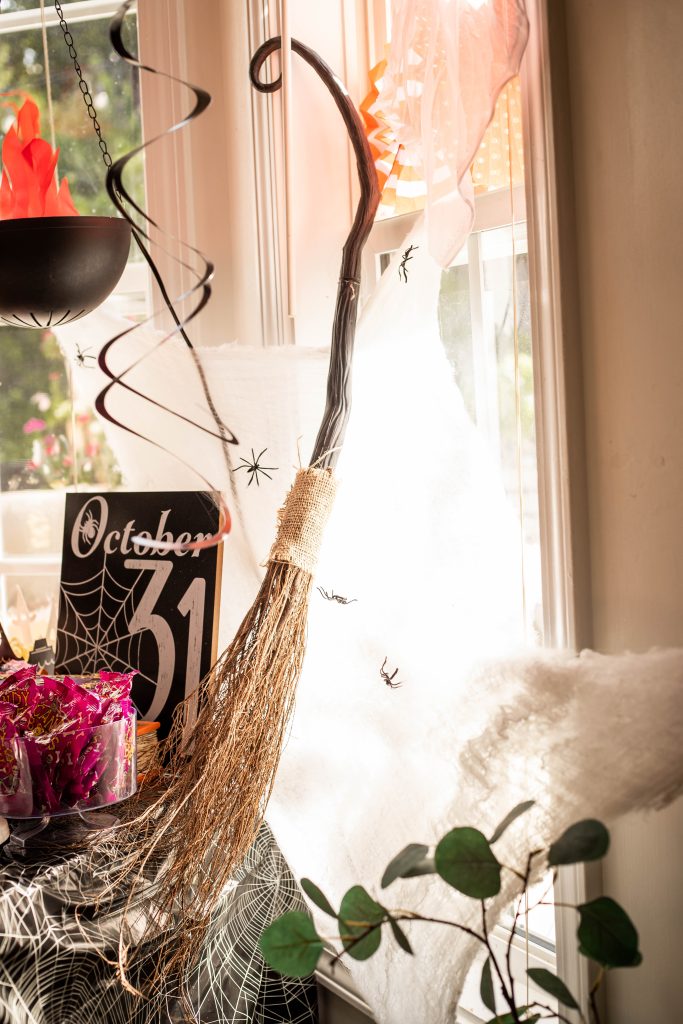 Hocus Pocus Halloween Party snack table with witches broom