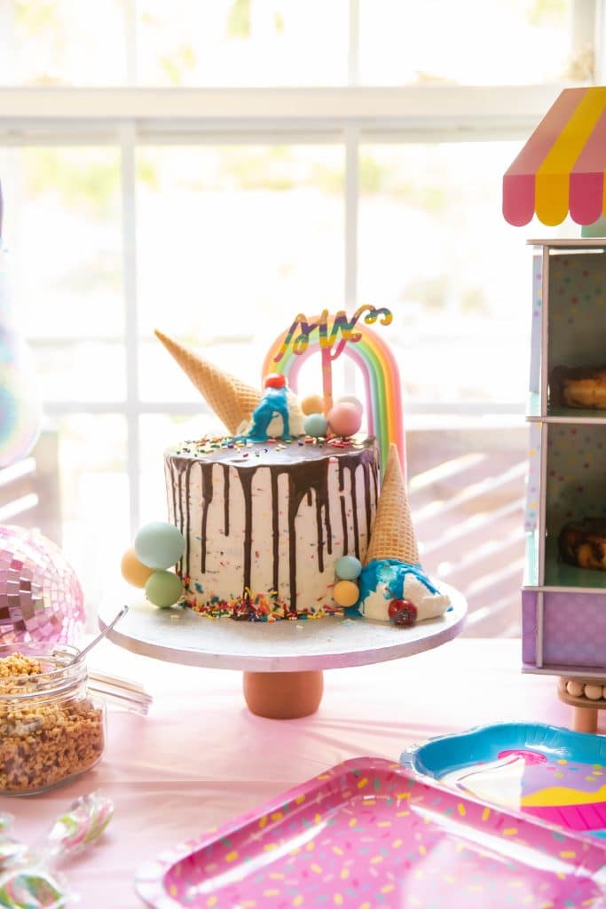 Sweets Squishmallows and 6 birthday cake with rainbow